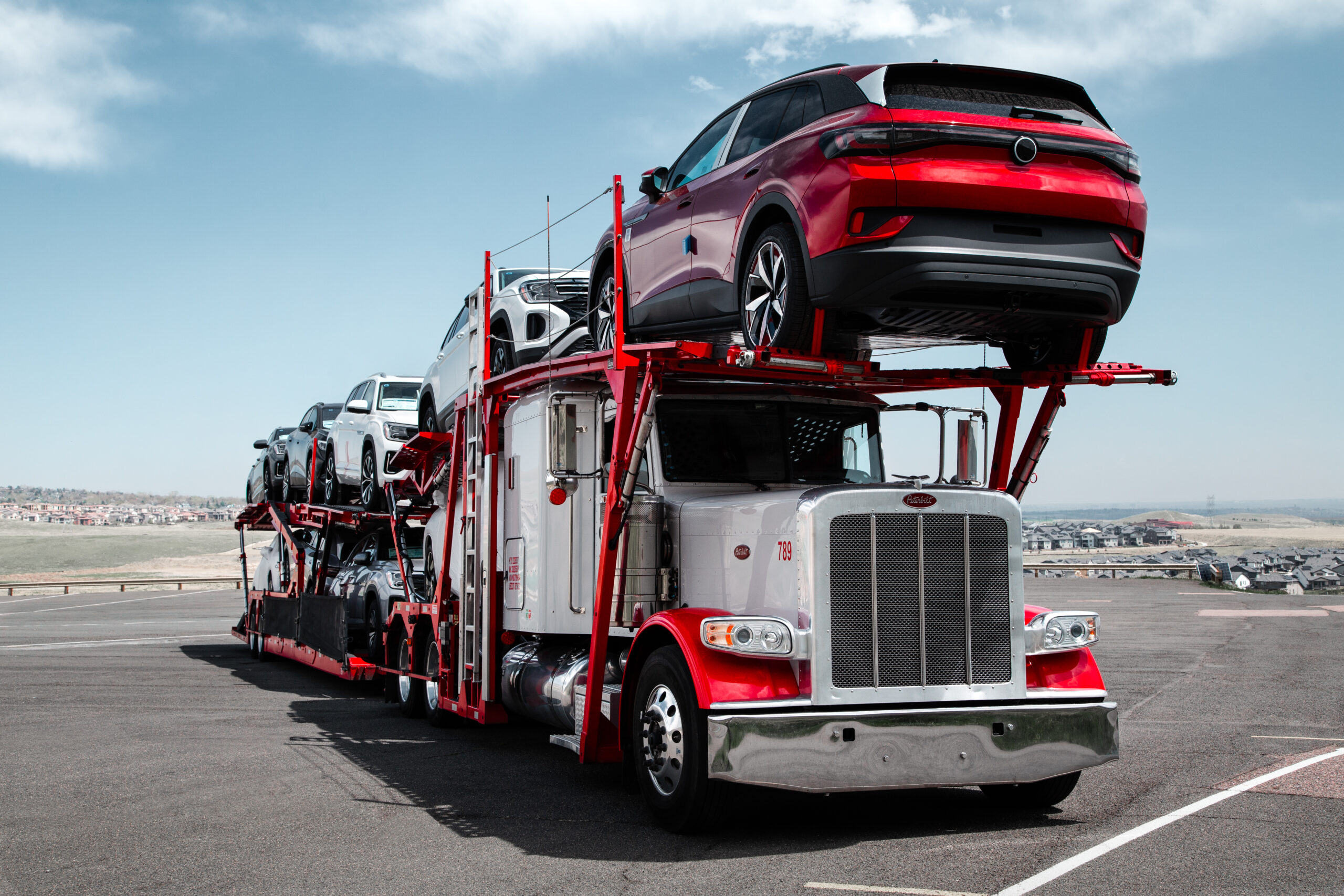 New vehicles loaded on an Accelerated car hauler