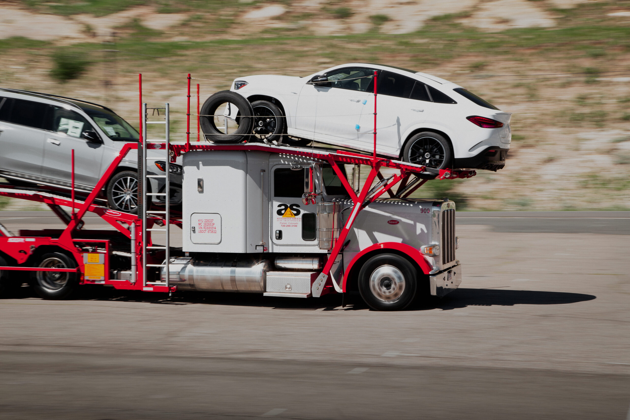 Accelerated car hauler in motion on the highway